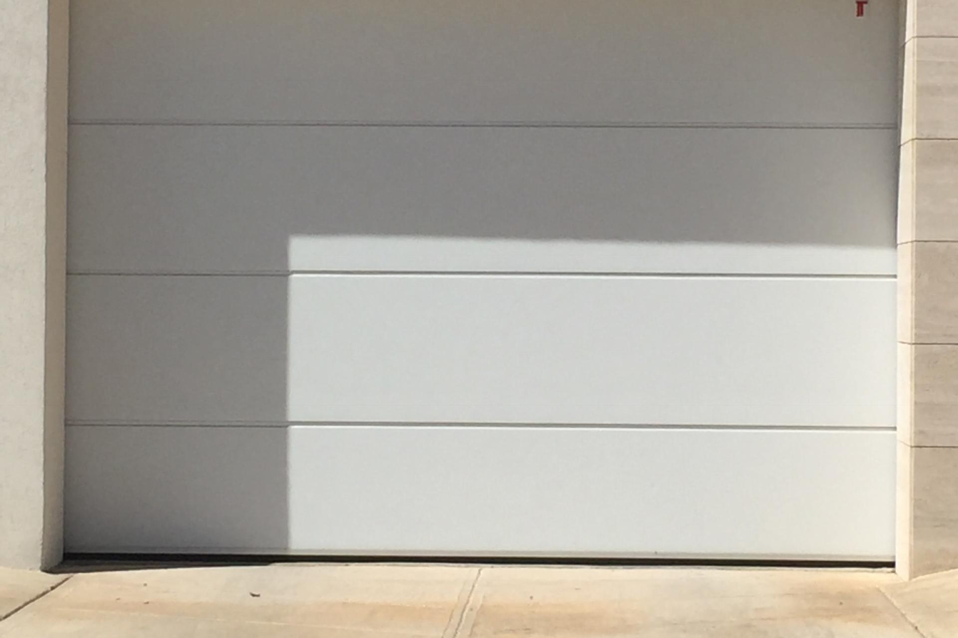 smooth panels , garage doors Malta